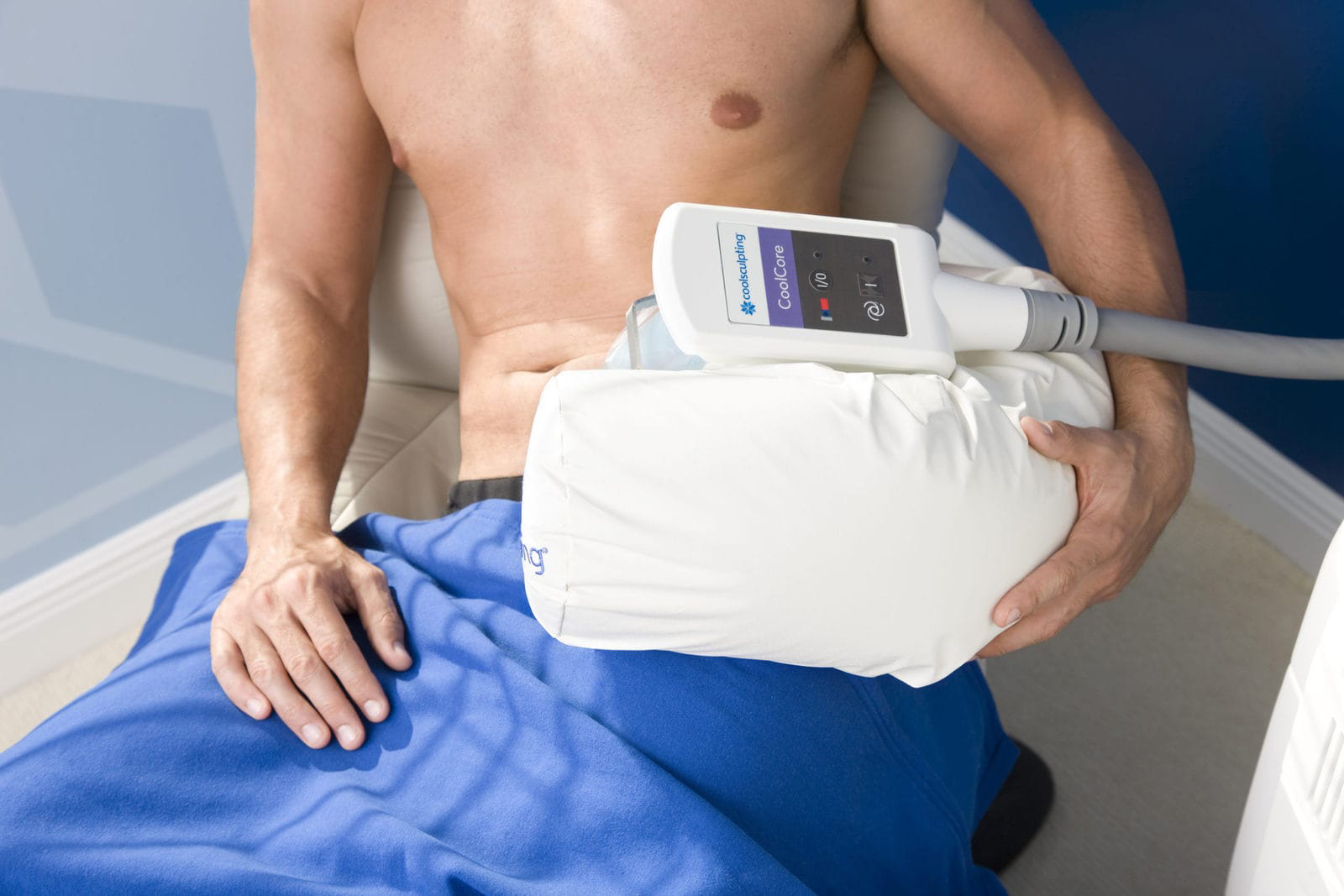 Male CoolSculpting patient undergoing treatment