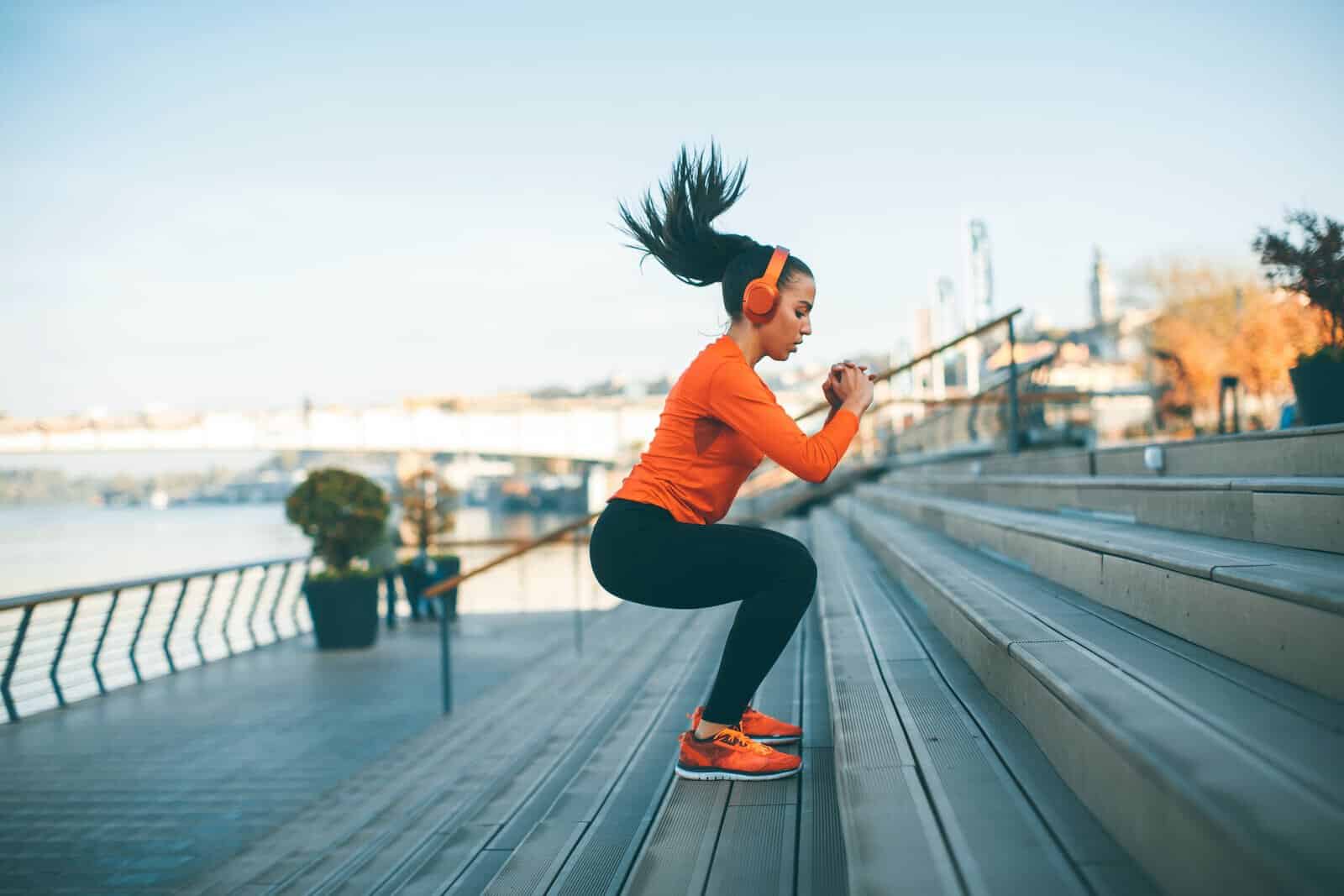 Slim Studio Fitness Programs - Girl Jumping and Doing Squats HIIT