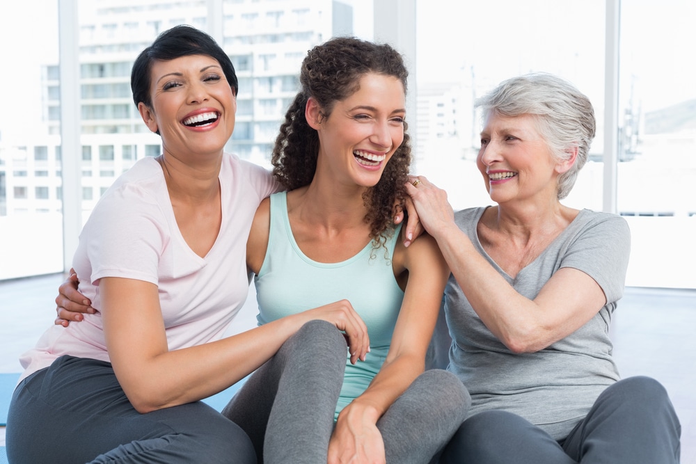 Group of three older women feeling boosted energy, metabolism, and more from HRT functional wellness treatment.