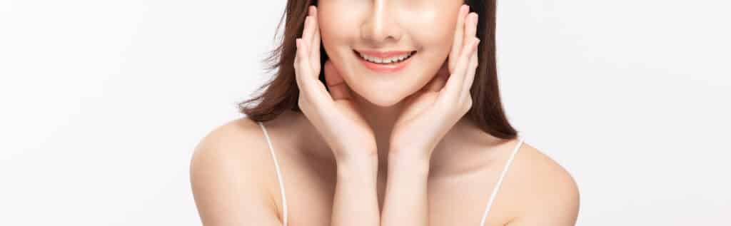 Close up of a woman with smooth, radiant skin after getting filler or SKINVIVE treatment.
